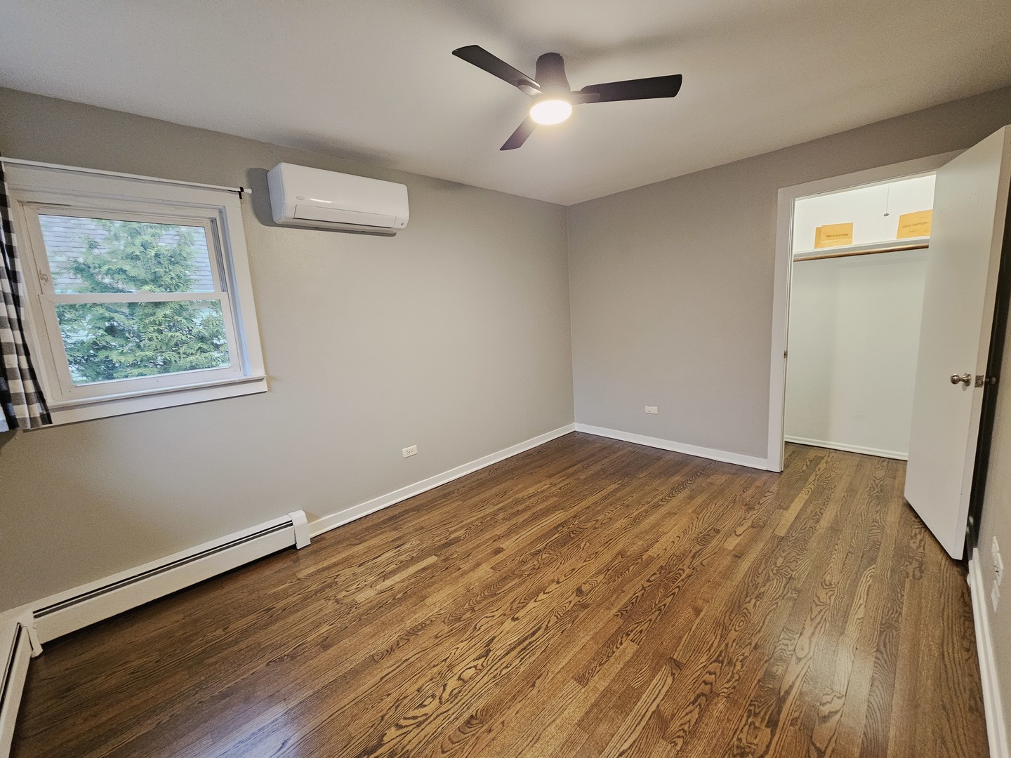311 Maple Avenue, Unit 2 Downers Grove, IL 60515 - Photo 24 of 33 a view of empty room with wooden floor and fan