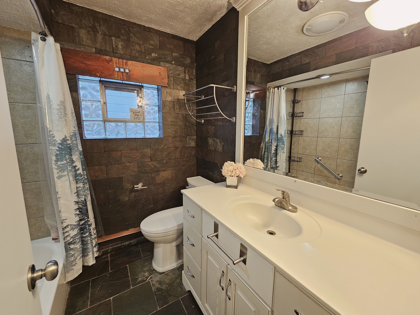 311 Maple Avenue, Unit 2 Downers Grove, IL 60515 - Photo 27 of 33 a bathroom with a sink toilet and shower
