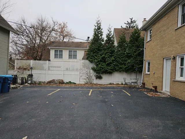 a view of a house with a yard and garage