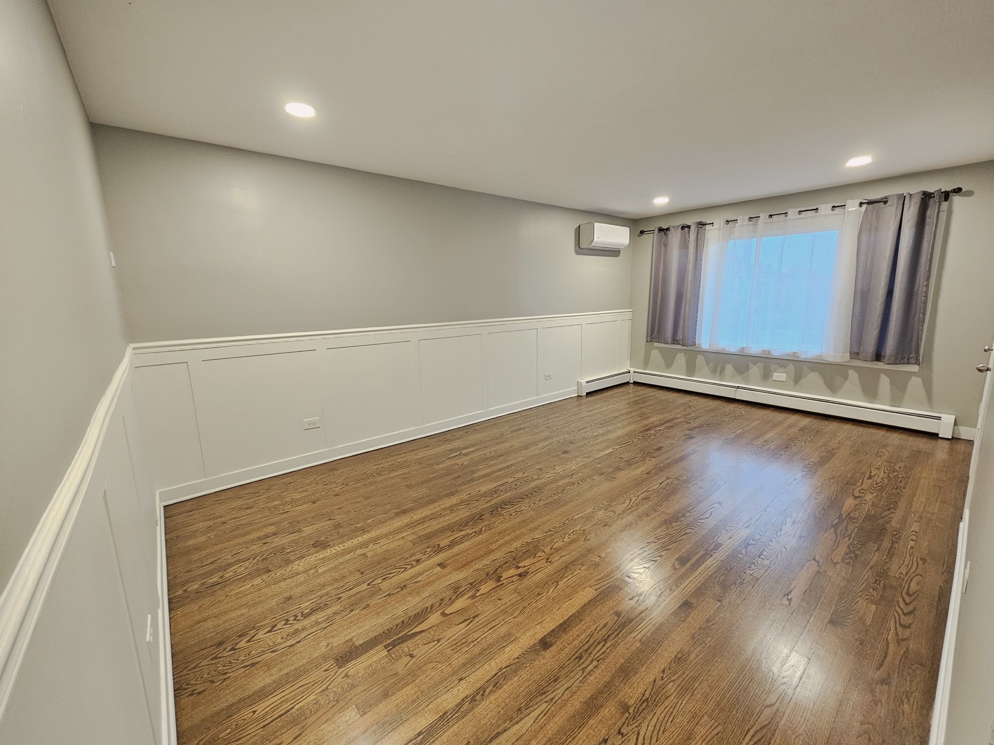 311 Maple Avenue, Unit 2 Downers Grove, IL 60515 - Photo 8 of 33 a view of an empty room with wooden floor