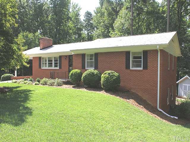 304 Ortega Road Raleigh, NC 27609 - Photo 1 of 16 a view of a house with backyard and garden