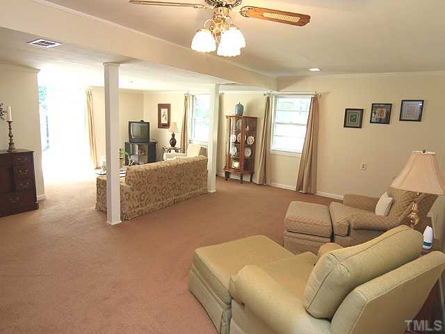 304 Ortega Road Raleigh, NC 27609 - Photo 10 of 16 a living room with furniture and a flat screen tv