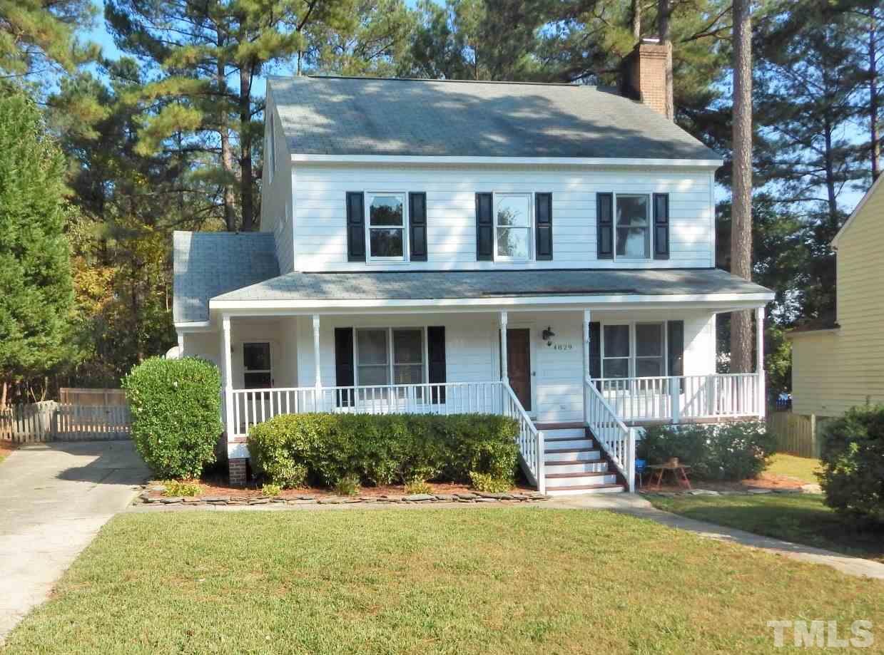 4829 Draper Road Raleigh, NC 27616 - Photo 1 of 25 a front view of a house with a yard and potted plants
