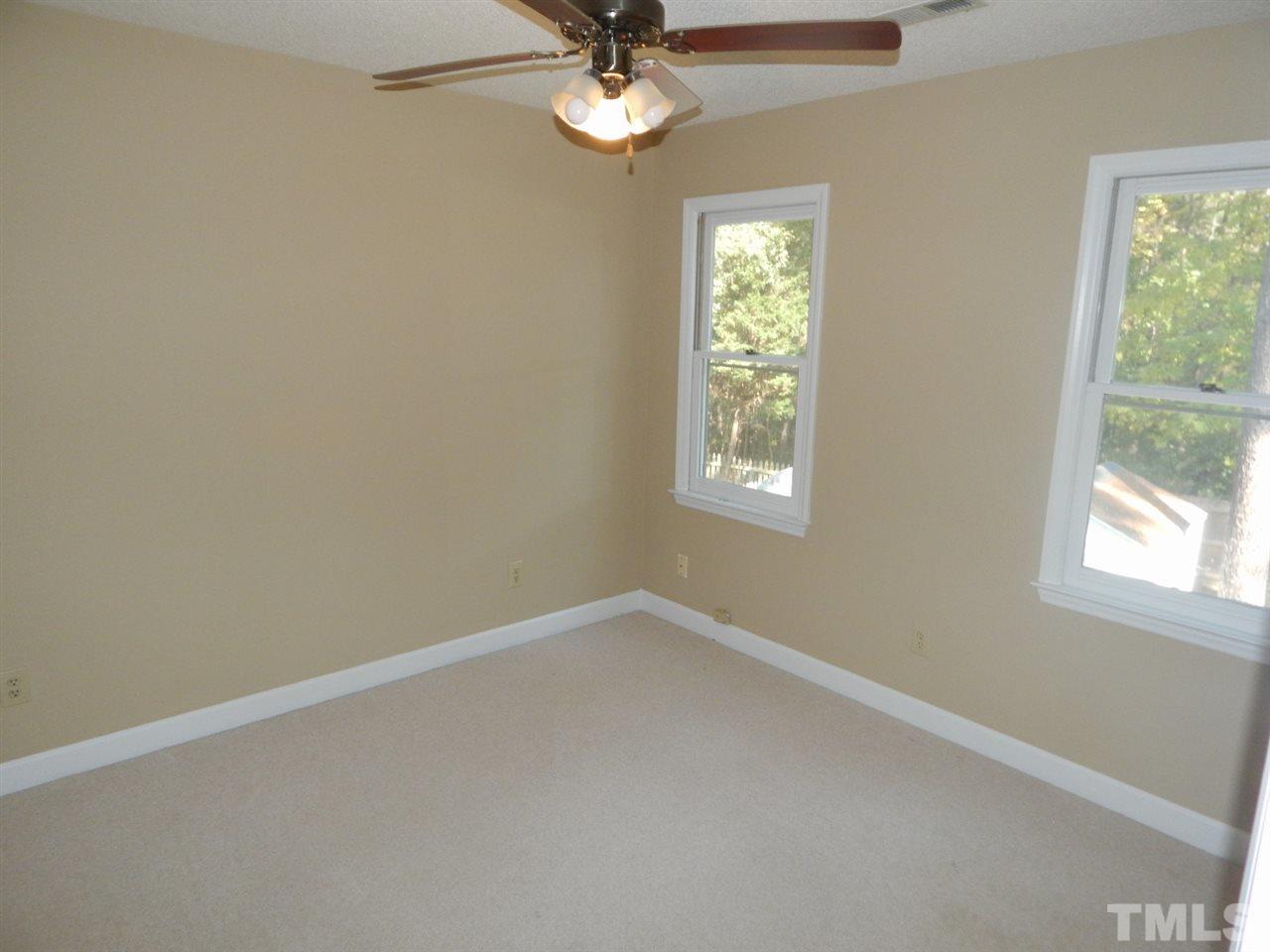 4829 Draper Road Raleigh, NC 27616 - Photo 14 of 25 an empty room with a window