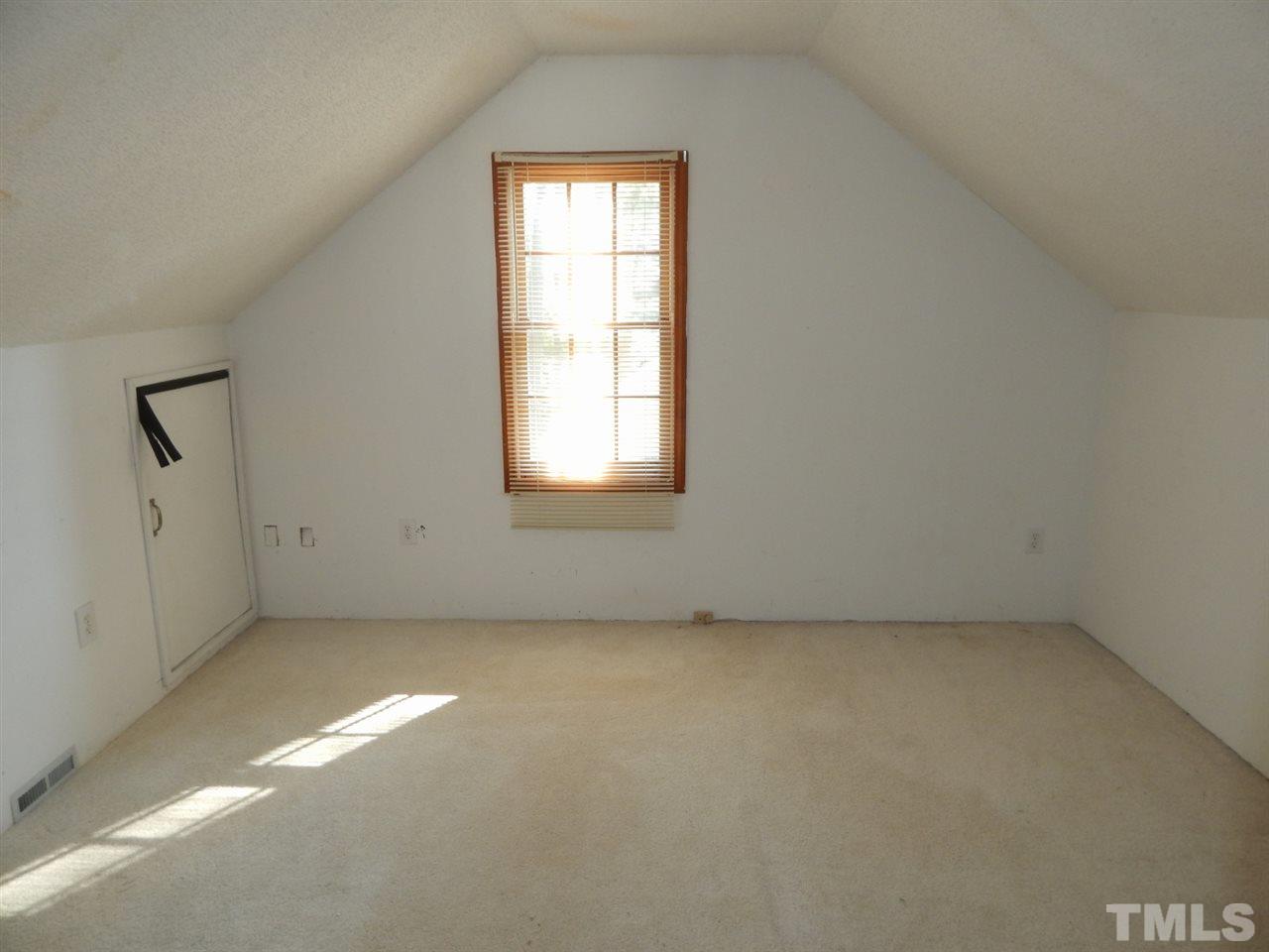 4829 Draper Road Raleigh, NC 27616 - Photo 17 of 25 an empty room with a window