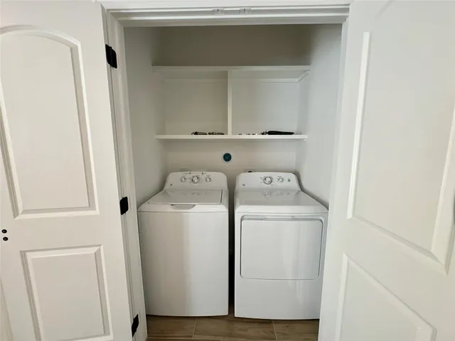 a bathroom with a granite countertop sink toilet a mirror and shower
