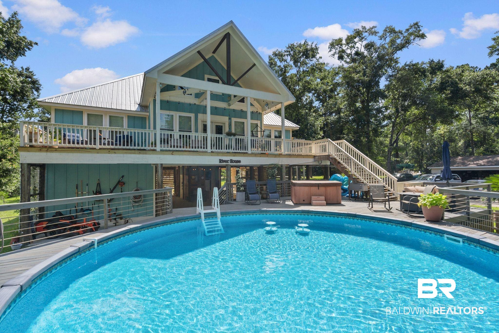 7266 Franklin Road Foley, AL 36535 - Photo 3 of 64 Outdoor swimming pool with integrated ladder and surrounding composite decking