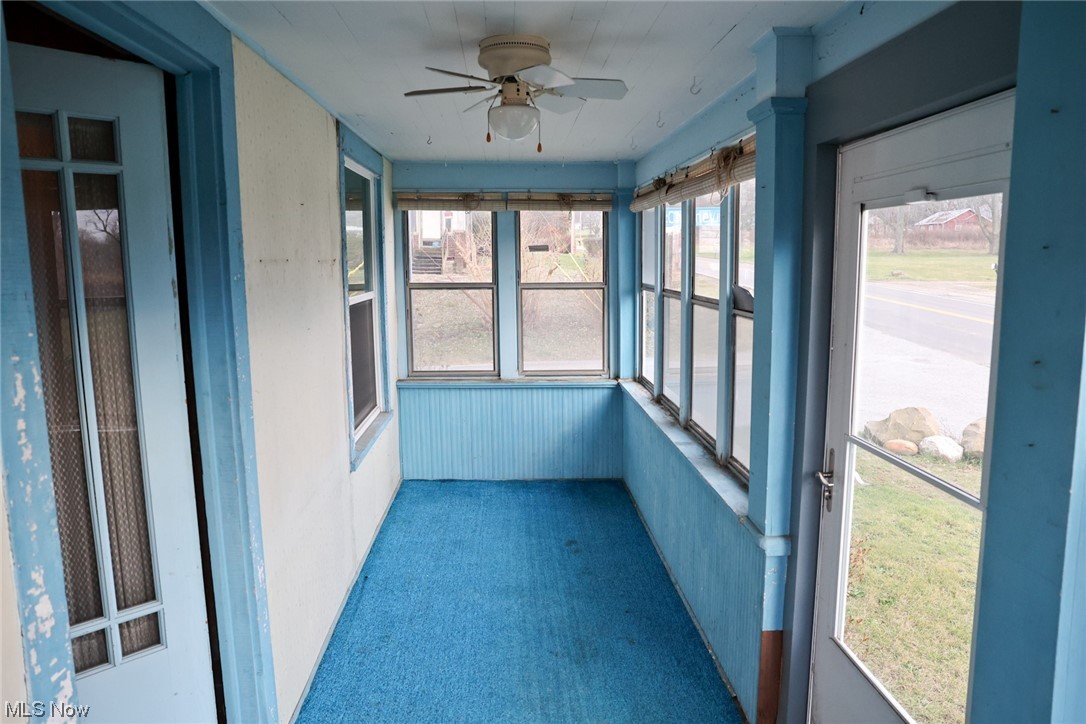 1309 Krumroy Road Akron, OH 44306 - Photo 4 of 30 Unfurnished sunroom featuring ceiling fan
