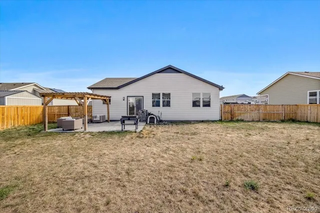 a house view with a backyard space