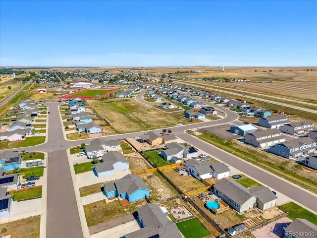 an aerial view of residential building and lake