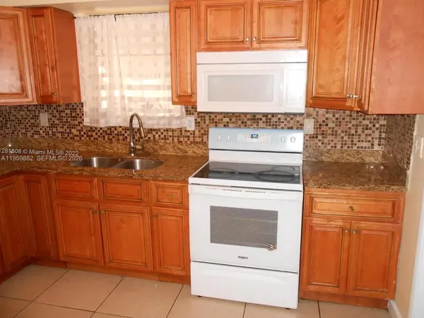 a view of a bathroom with a sink and a window