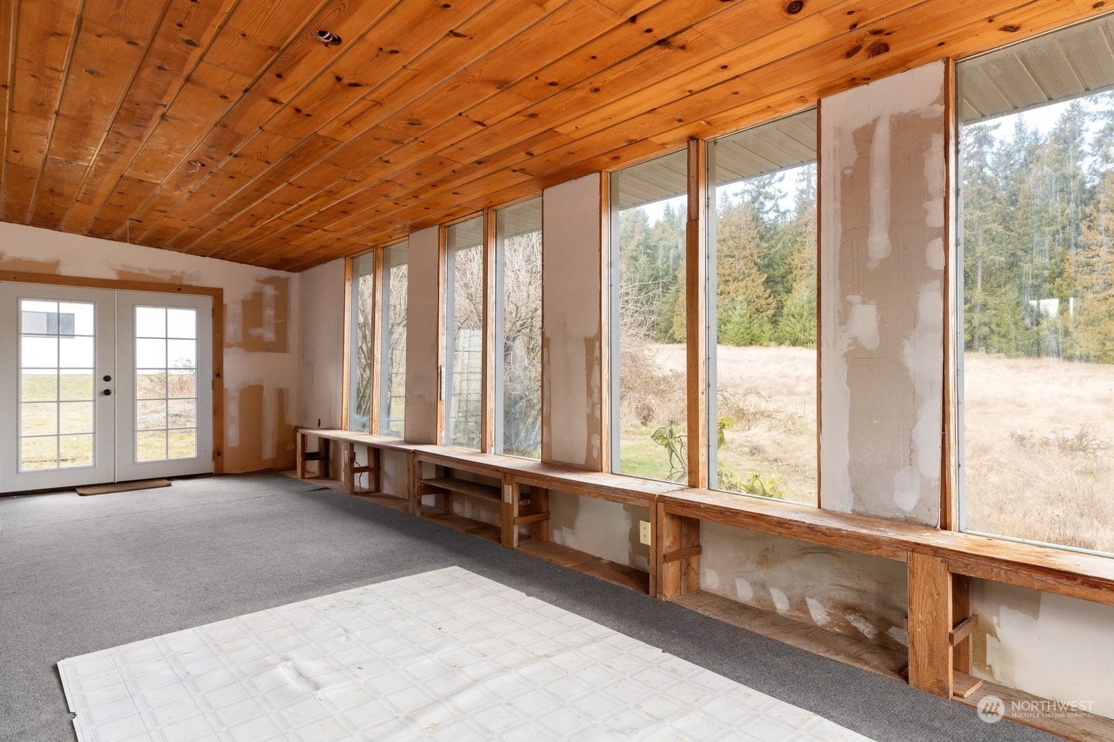 2575 Thompson Road Langley, WA 98260 - Photo 14 of 37 a view of an empty room with windows