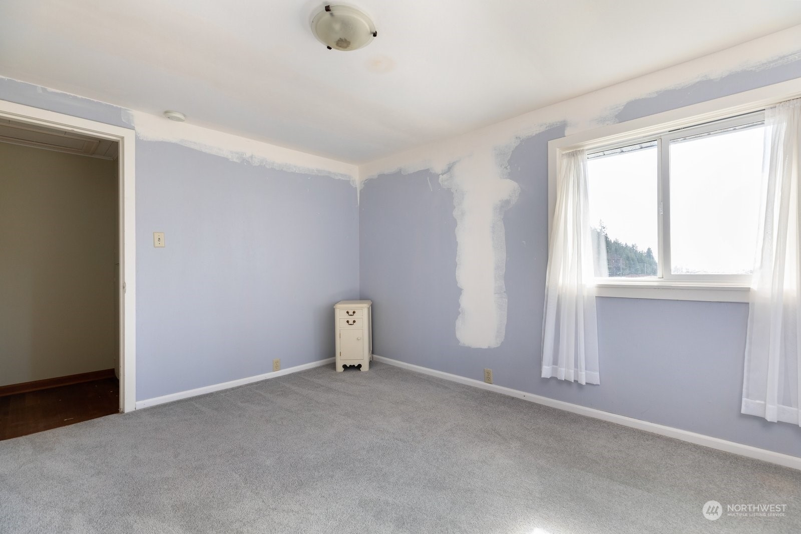 2575 Thompson Road Langley, WA 98260 - Photo 18 of 37 a view of an empty room with a window