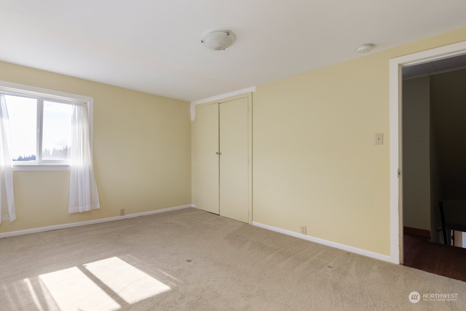 2575 Thompson Road Langley, WA 98260 - Photo 21 of 37 a view of an empty room and a window