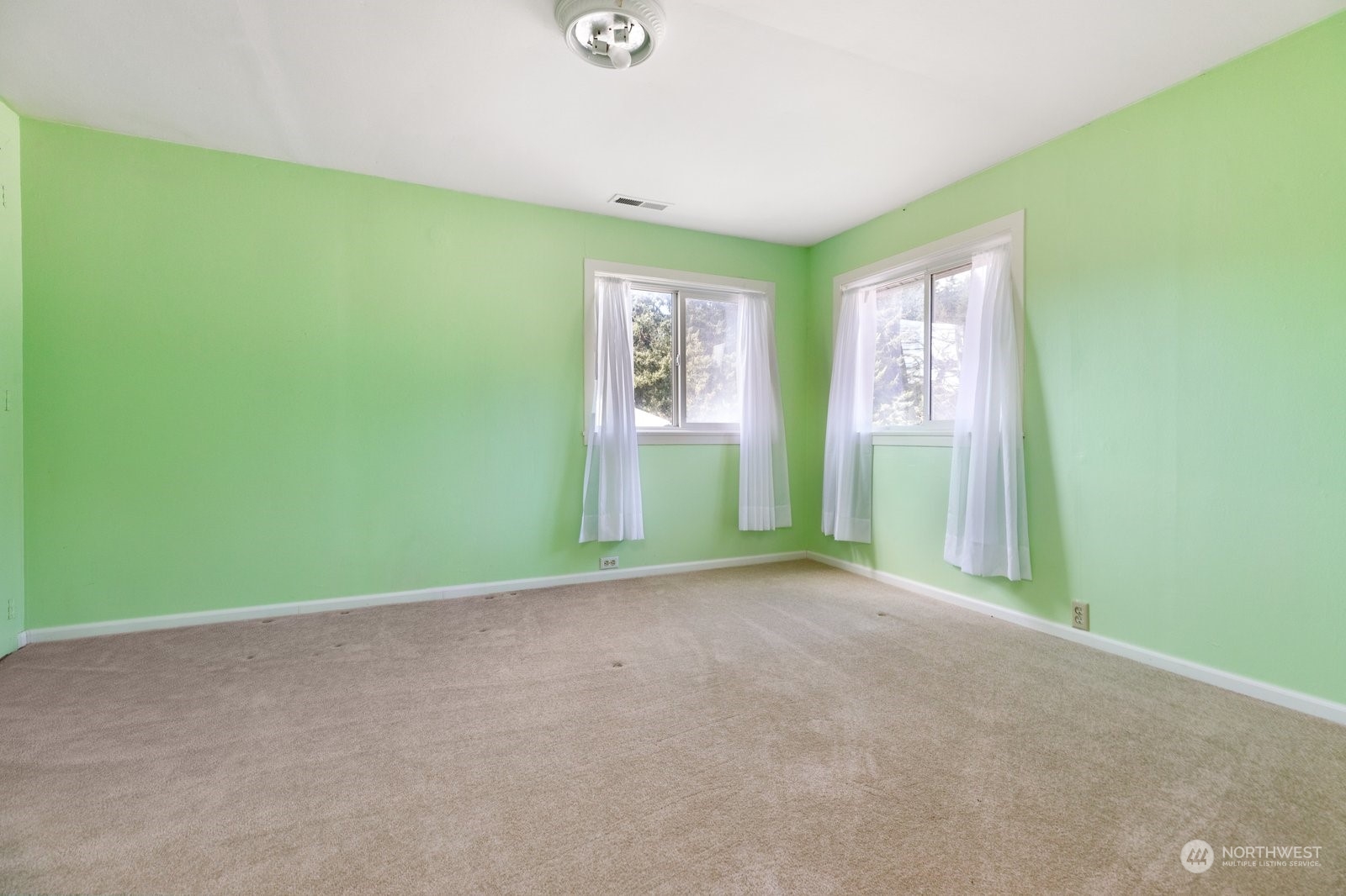 2575 Thompson Road Langley, WA 98260 - Photo 24 of 37 a view of a room with a window and a ceiling fan
