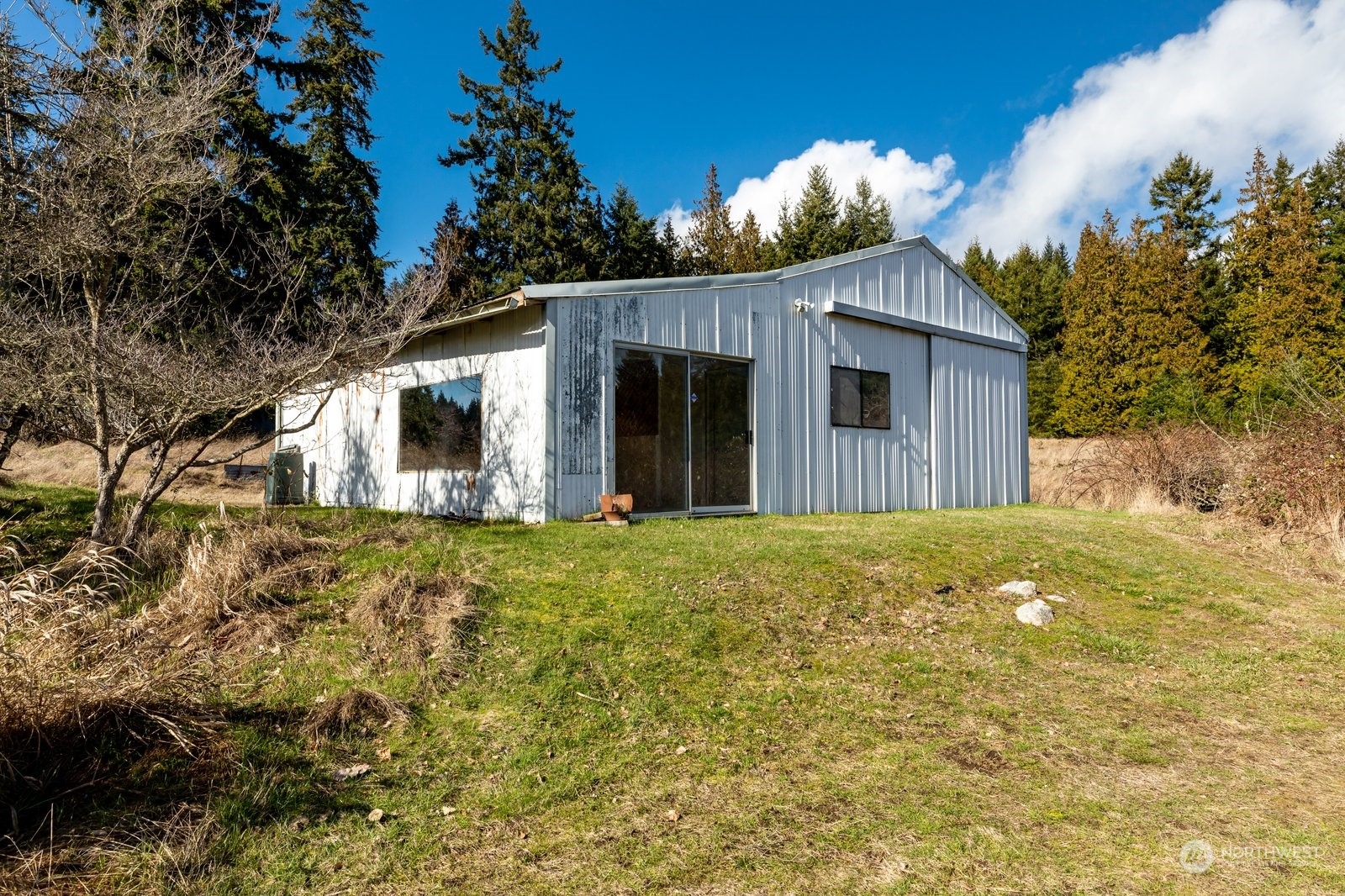 2575 Thompson Road Langley, WA 98260 - Photo 29 of 37 a view of a house with a large tree and a yard