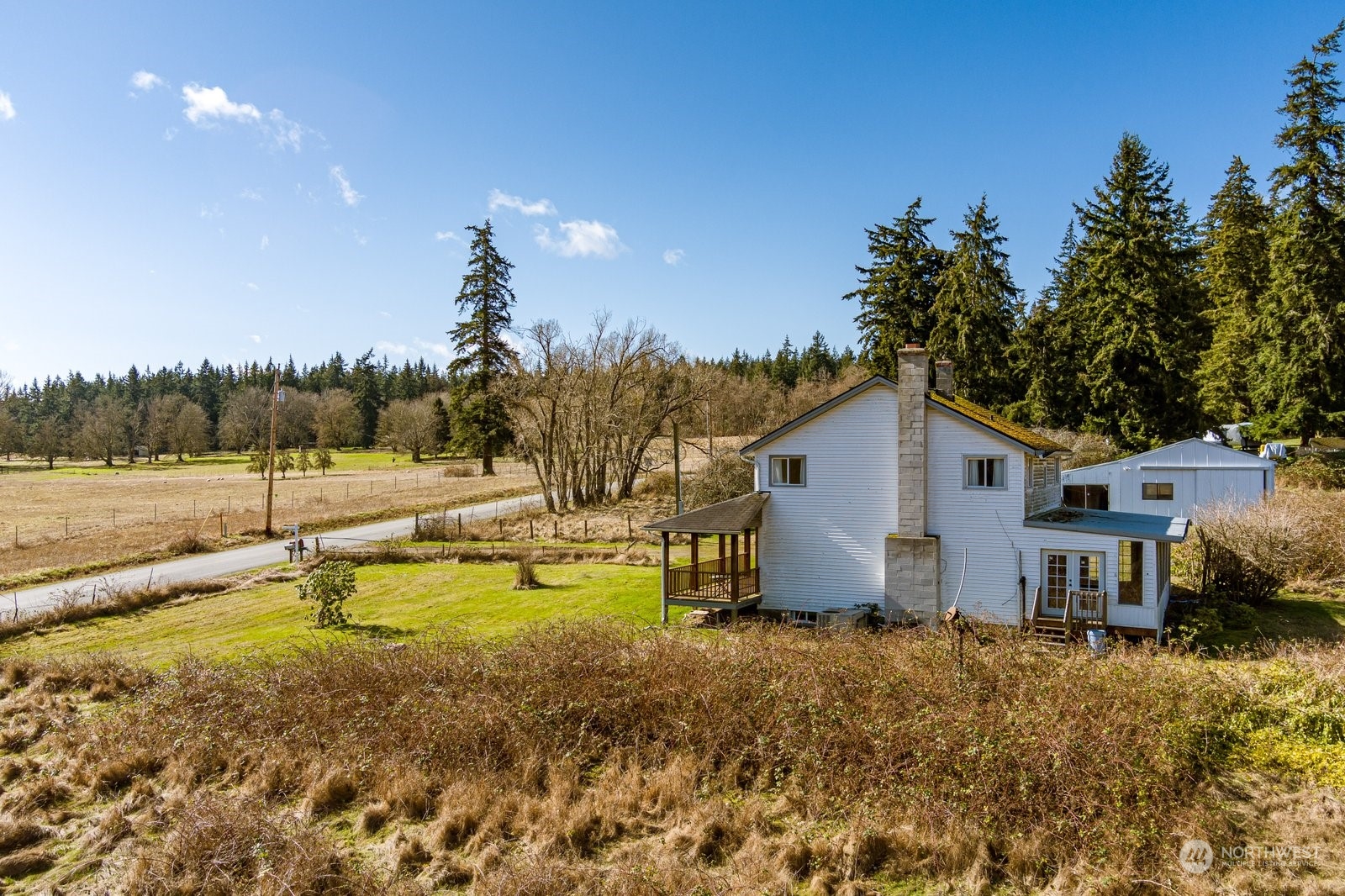 2575 Thompson Road Langley, WA 98260 - Photo 30 of 37 a view of a house with swimming pool and a yard