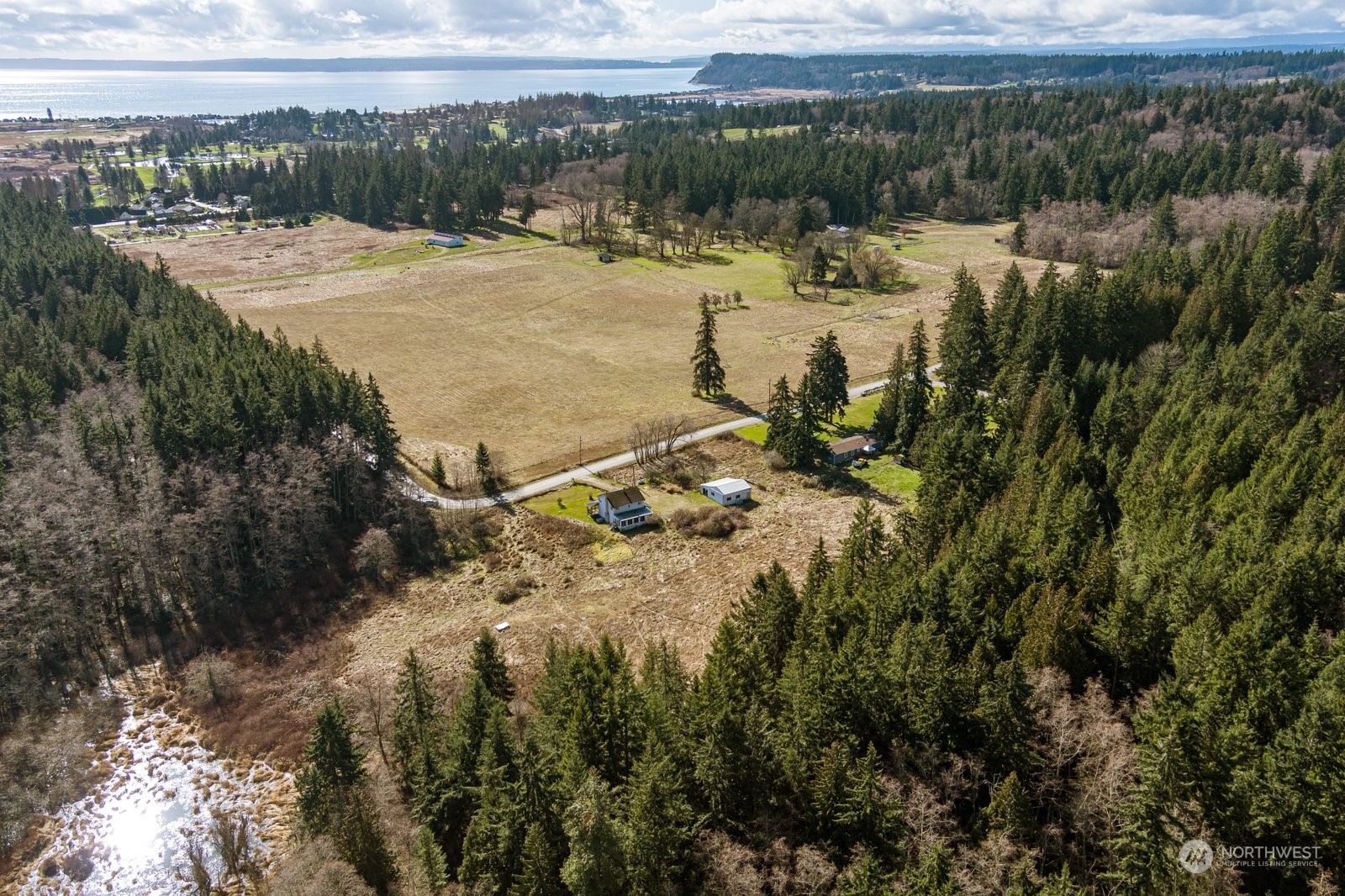 2575 Thompson Road Langley, WA 98260 - Photo 32 of 37 a view of a lake with a mountain