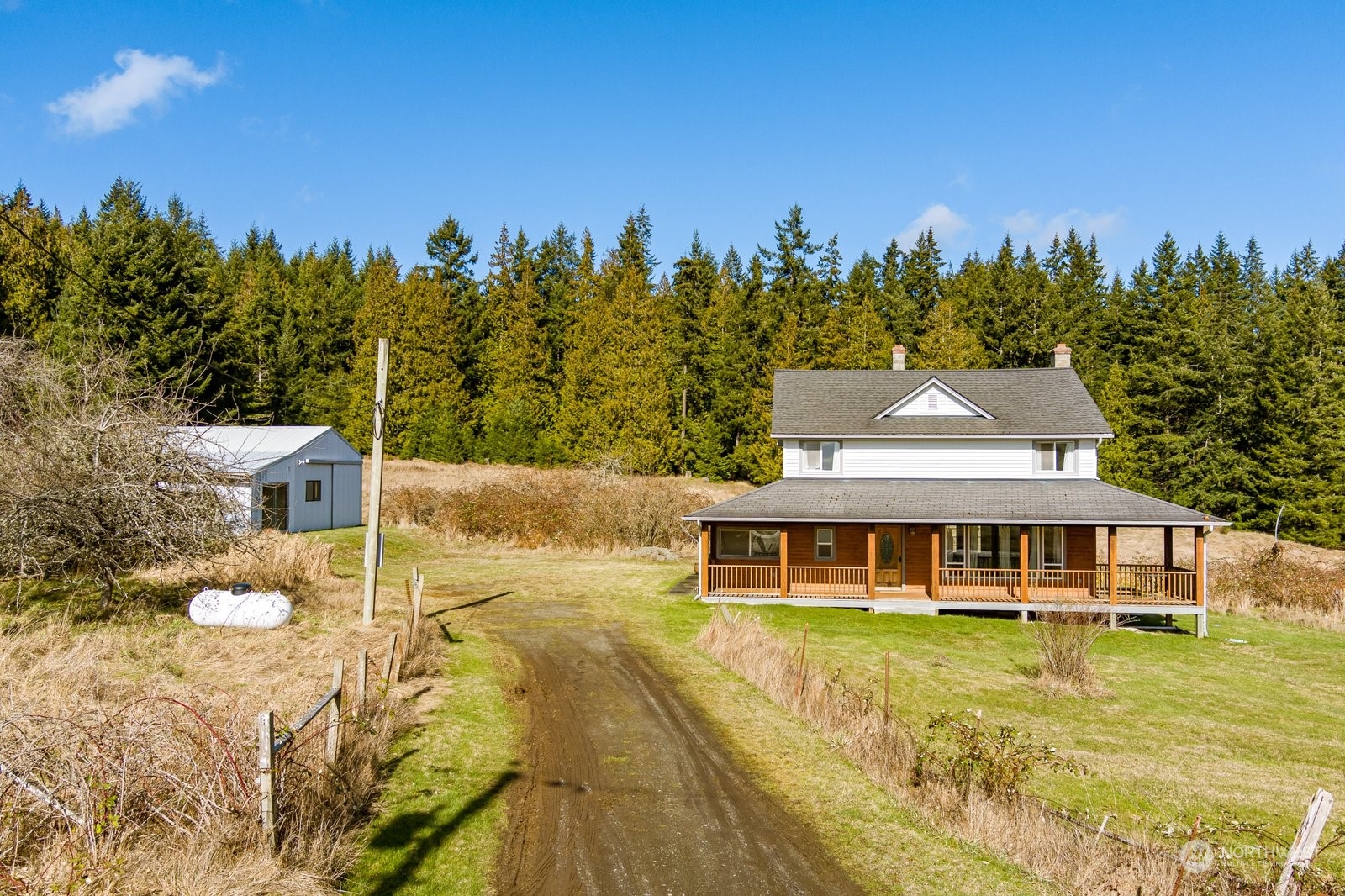 2575 Thompson Road Langley, WA 98260 - Photo 35 of 37 a front view of a house with a garden and swimming pool