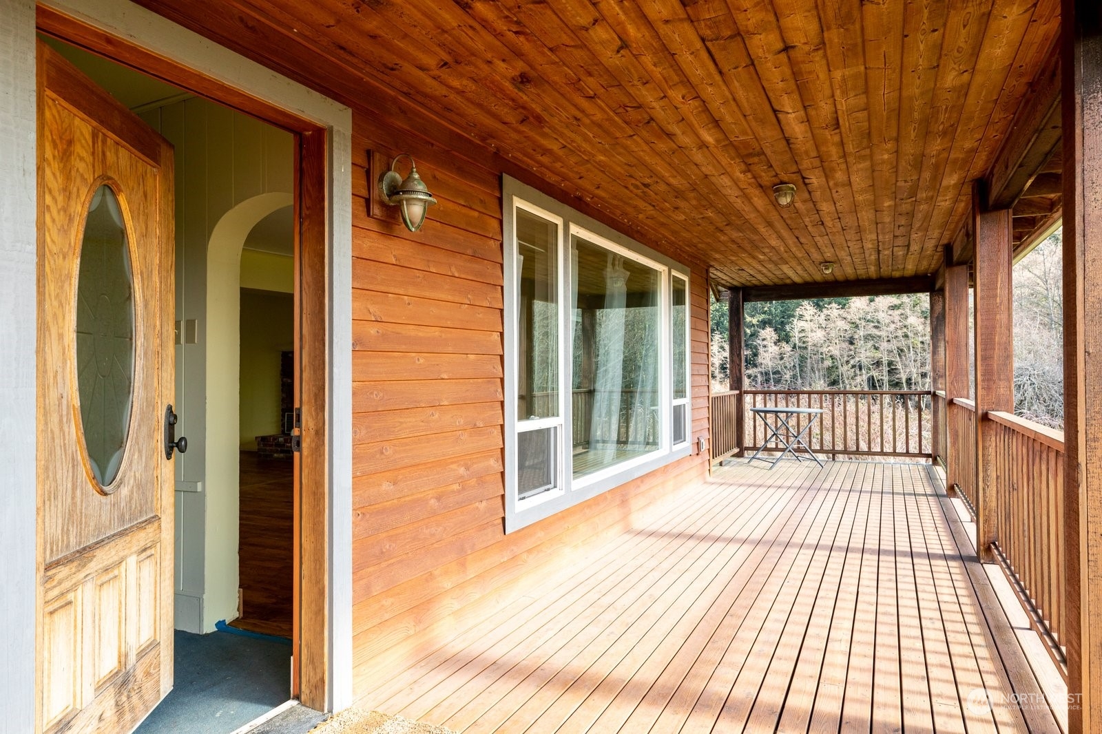 2575 Thompson Road Langley, WA 98260 - Photo 4 of 37 a view of a balcony with wooden floor