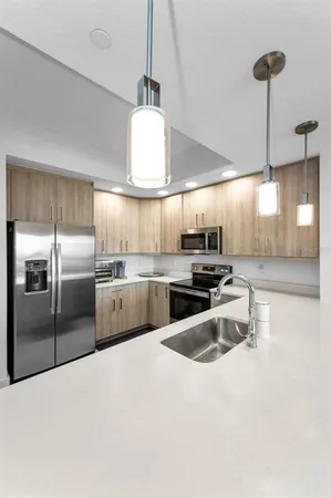 a bathroom with a double vanity sink a mirror and a shower