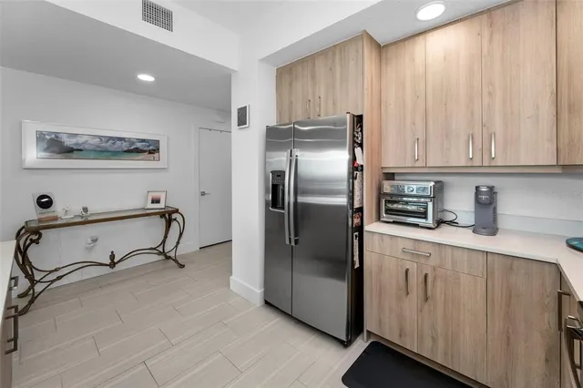 a view of a room with wooden floor and gym equipment