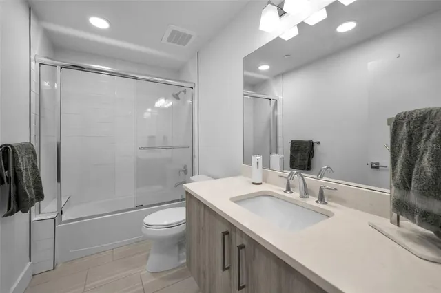 an aerial view of a house with outdoor space and lake view