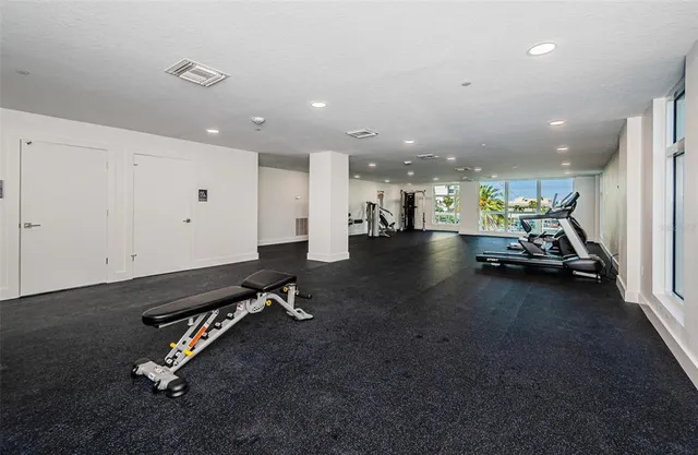 a view of a lake with couches chairs