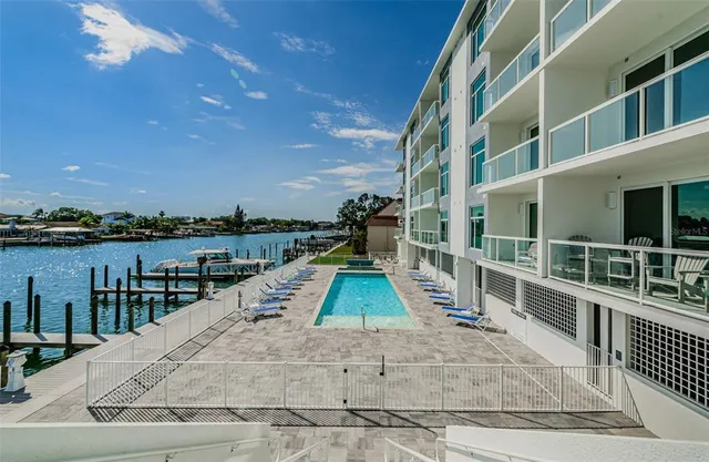 a view of a house with backyard porch and sitting area