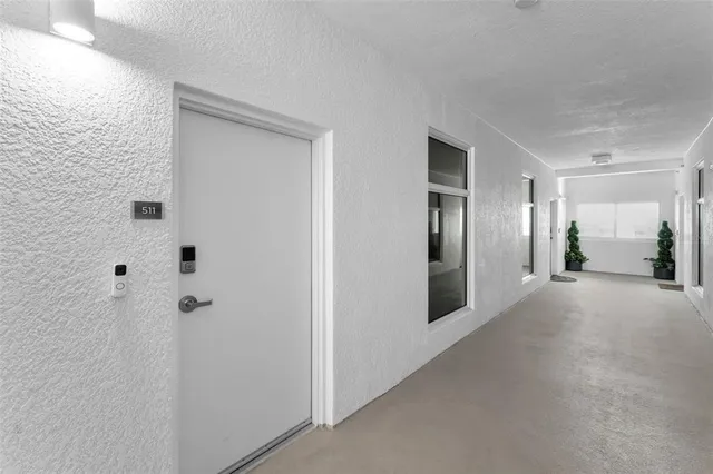 a balcony with a table and chairs