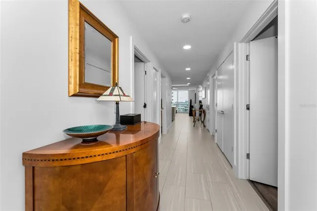 a living room with furniture ceiling fan and a rug