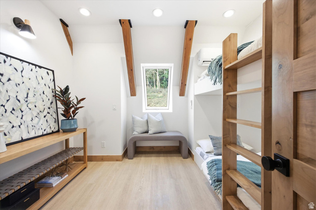 1833 Pine Loop Road Coalville, UT 84017 - Photo 16 of 26 Room featuring built-in bunk beds, light wood-finish flooring, and white walls