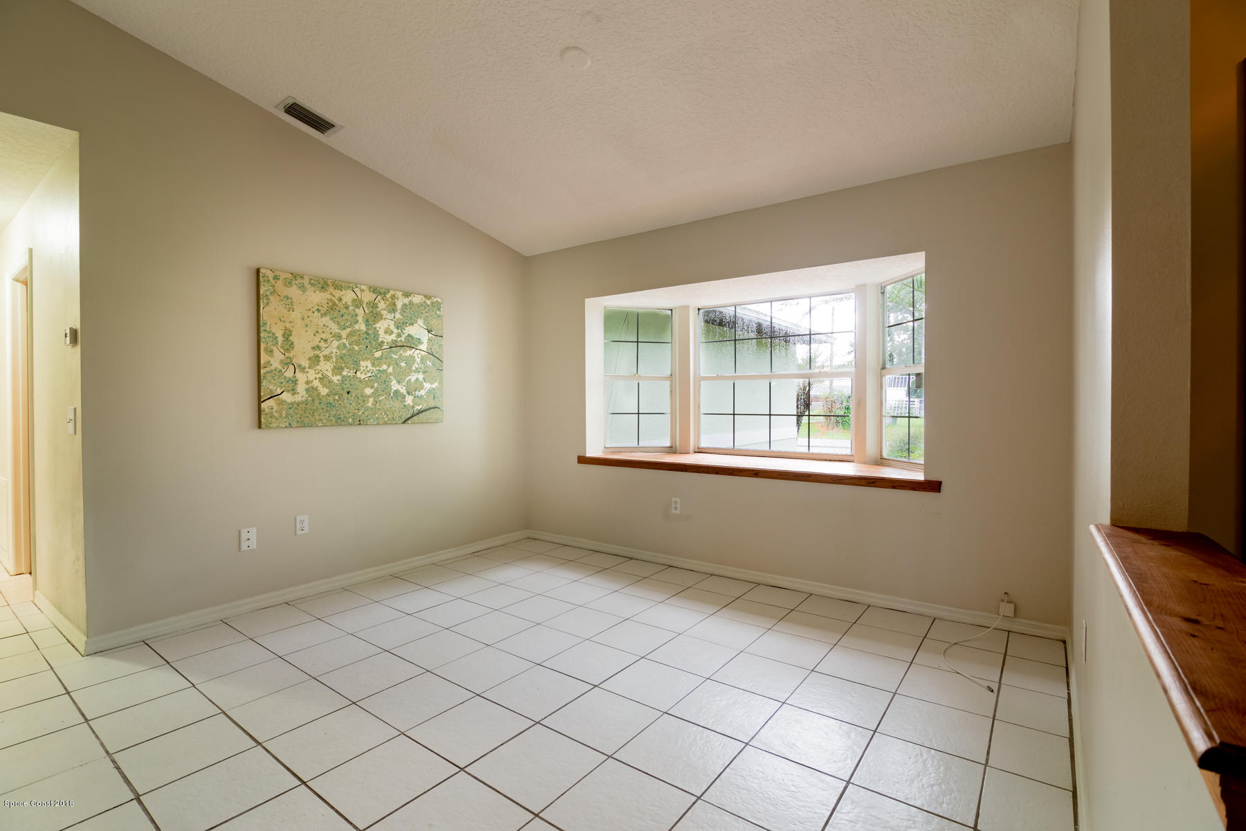 5107 Arlington Road Cocoa, FL 32927 - Photo 3 of 18 Separate Dining Room with Bay Window