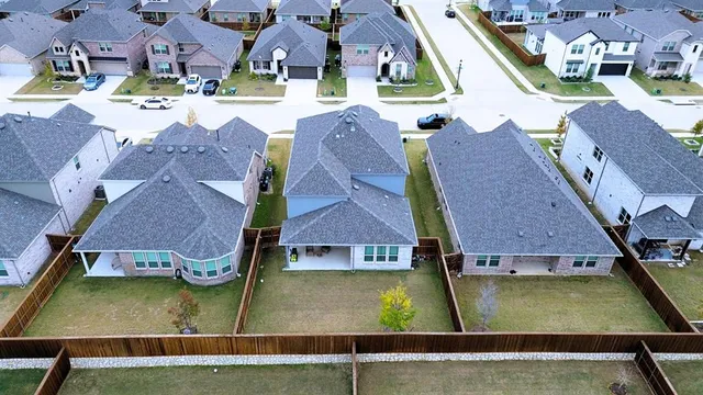 an aerial view of residential houses with swimming pool