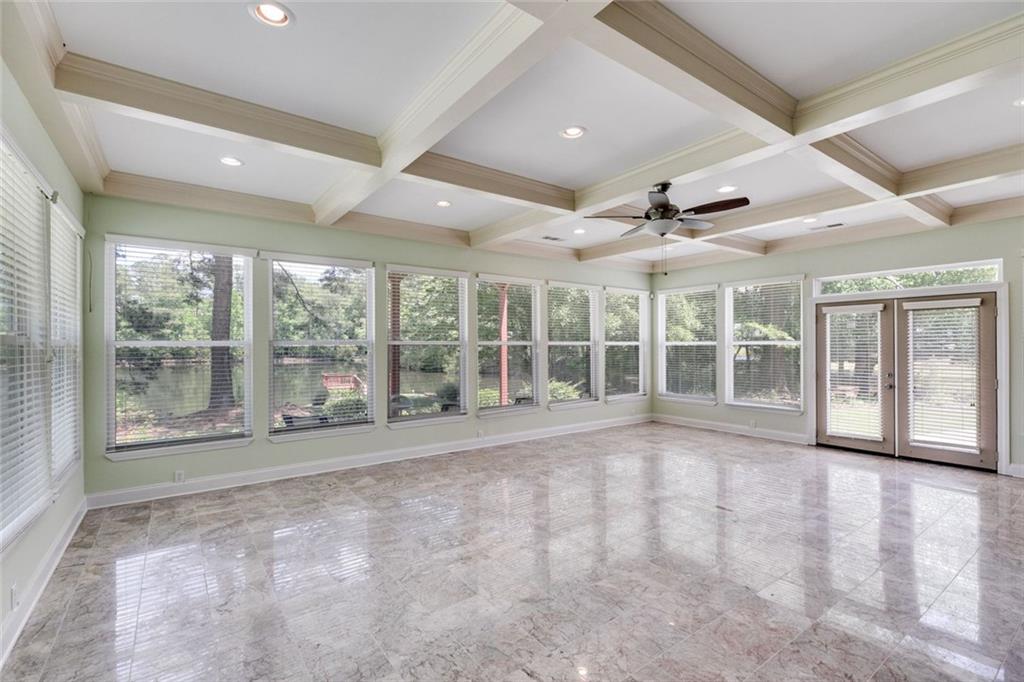 110 Pond View Point LaGrange, GA 30240 - Photo 24 of 68 a view of an empty room with a large window and wooden floor