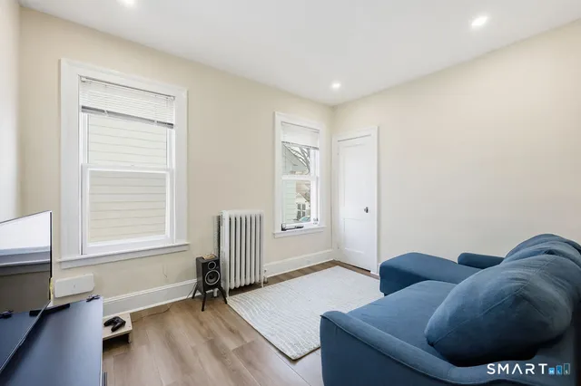 a living room with furniture and a window