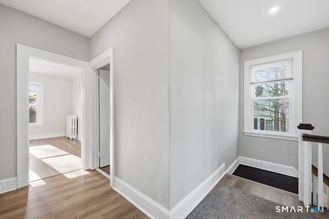 a view of an empty room and a window