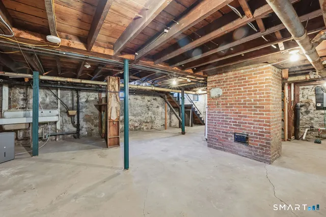 a view of empty room with wooden ceiling