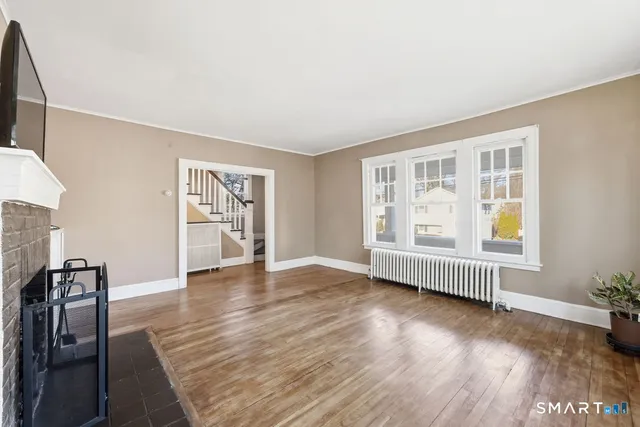 a view of livingroom with hardwood floor and window