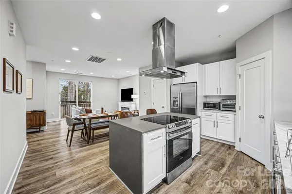 a kitchen with a stove and a refrigerator