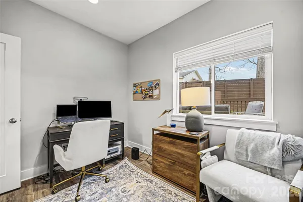 a work room with furniture and a window