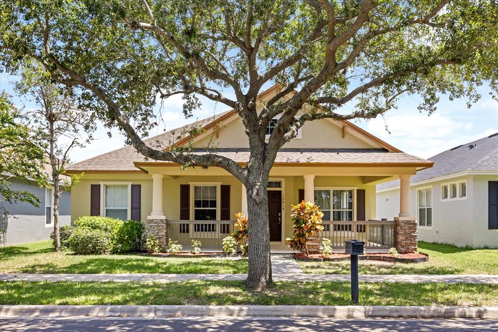 12915 Cragside Lane Windermere, FL 34786 - Photo 1 of 1 a front view of a house with garden