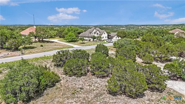 a view of a yard with an outdoor seating