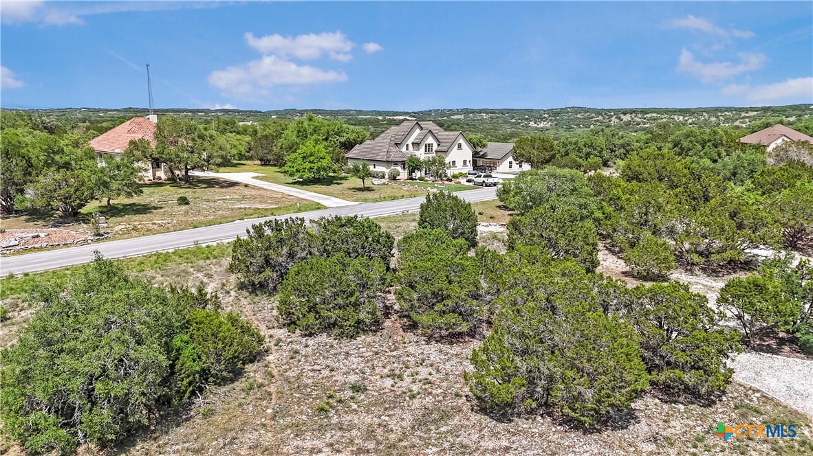 a view of a yard with an outdoor seating