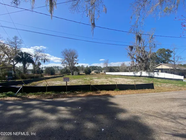 a view of a lake with a big yard