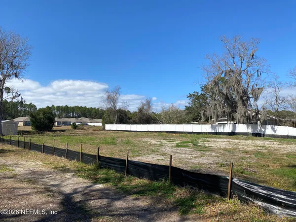 a fire hydrant in the middle of a field