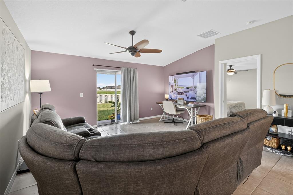 9645 Lemon Drop Loop Ruskin, FL 33573 - Photo 16 of 49 a living room with furniture and a large window