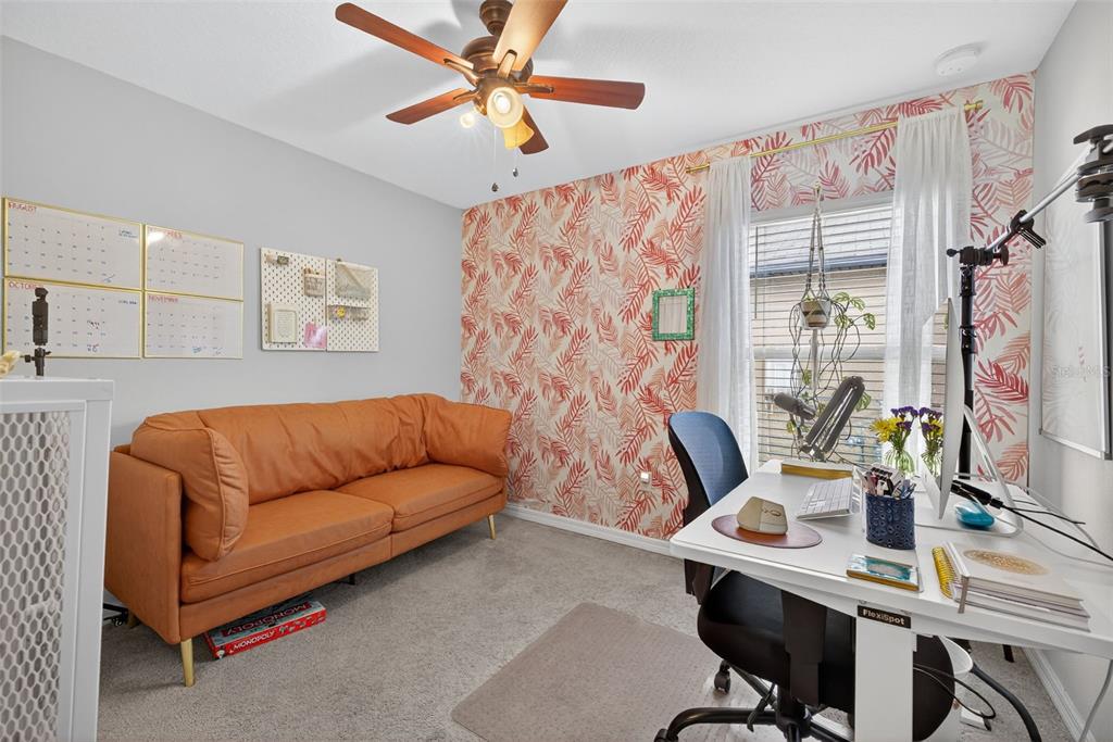 9645 Lemon Drop Loop Ruskin, FL 33573 - Photo 25 of 49 a work room with furniture and a window