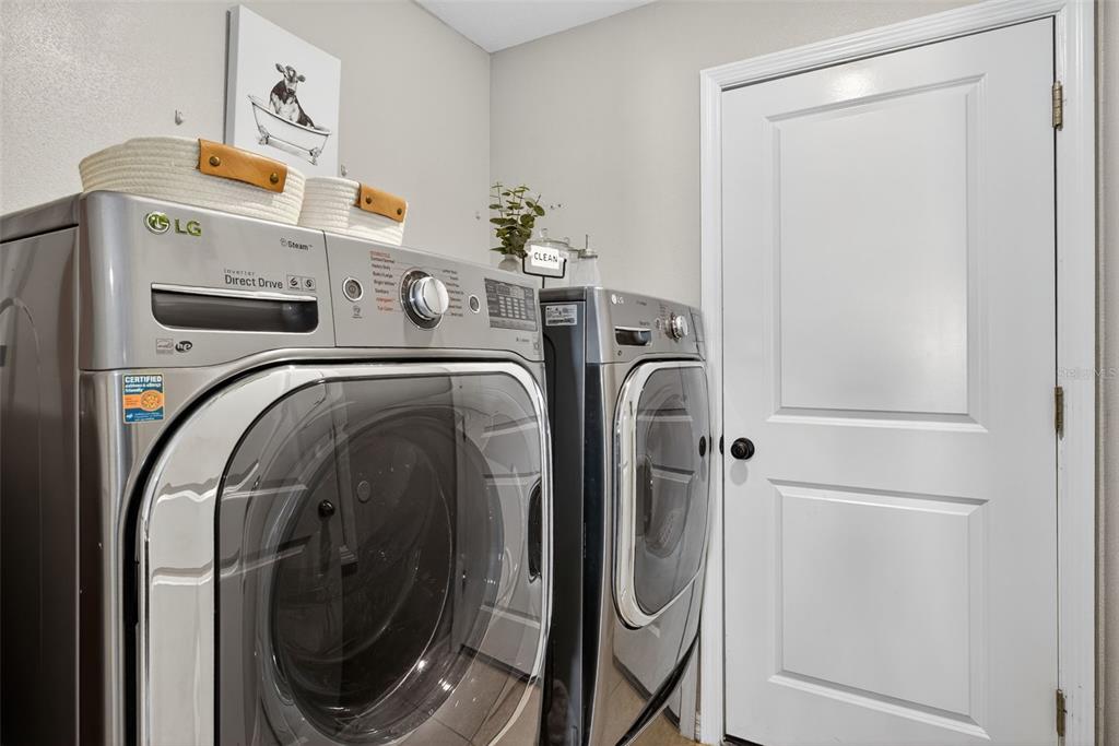 9645 Lemon Drop Loop Ruskin, FL 33573 - Photo 27 of 49 a utility room with dryer and washer