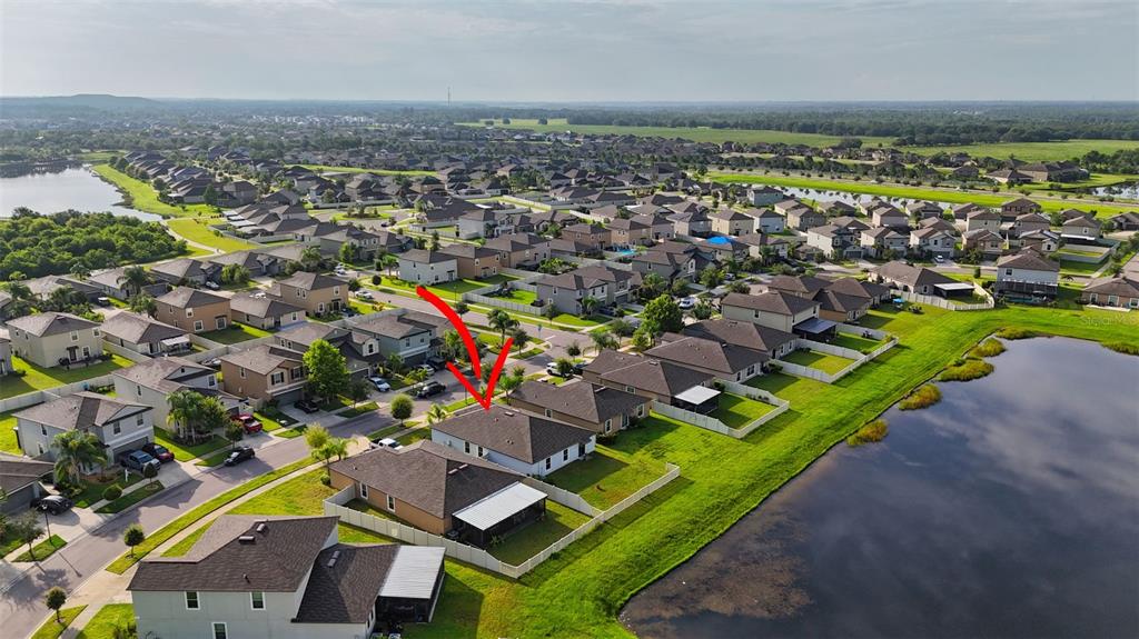 9645 Lemon Drop Loop Ruskin, FL 33573 - Photo 47 of 49 an aerial view of residential houses with outdoor space and swimming pool
